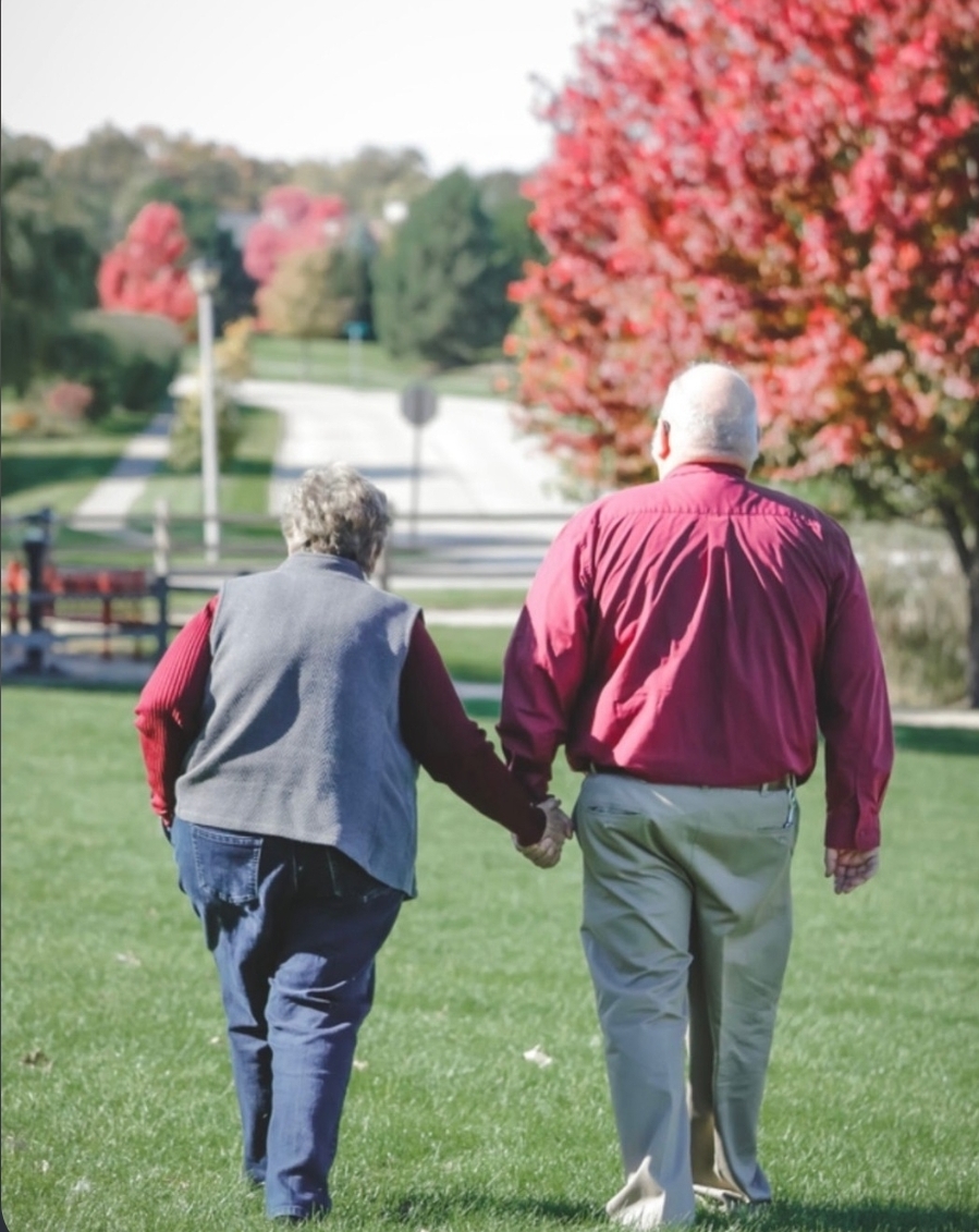 Karen and her husband walking hand in hand